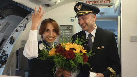 A captain proposed to a stewardess aboard a flight to Kraków, Poland, the city where they first met.
