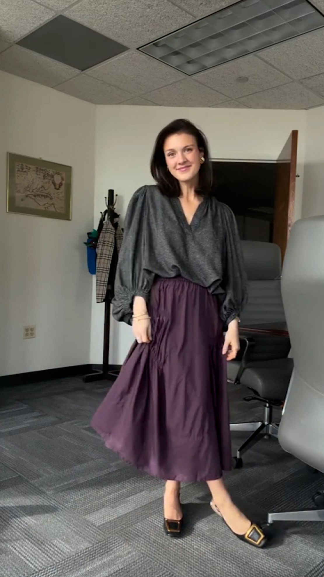 This still from video originally posted to Instagram shows Office of Personnel Management spokesperson McLaurine Pinover as she films fashion content in her office.