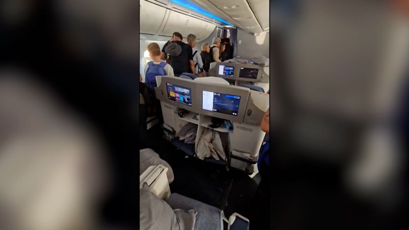 Video shows passenger stuck in overhead bin after severe turbulence | CNN