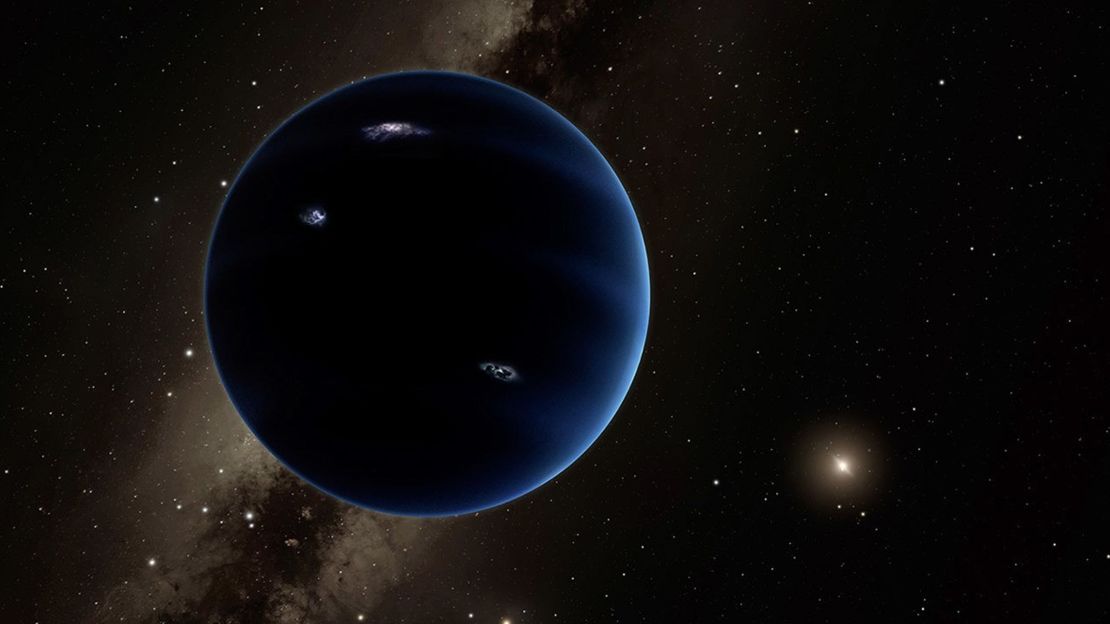 An artist's concept illustrates the theorized Planet Nine, which Batygin and Brown believe to be five to seven times the mass of Earth. A competing theory proposes the existence of a hidden Kuiper Belt planet that’s smaller, with a mass between 1.5 and 3 times that of our world.