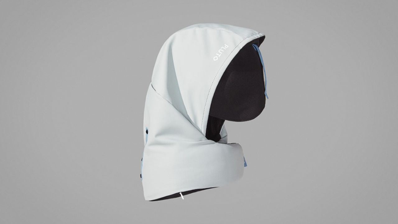 A photo of a white Pluto Pod Travel Pillow