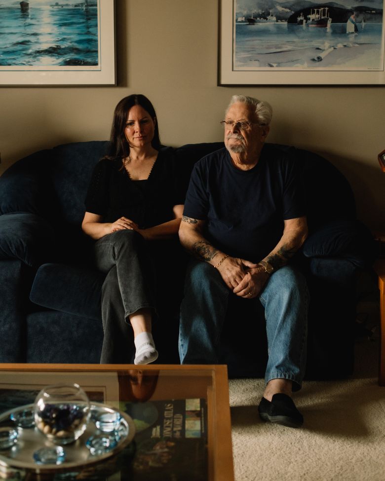 Bill Calder and his daughter Maggie Mori sit at his home in Tsawwassen, British Columbia, across the border from Point Roberts.