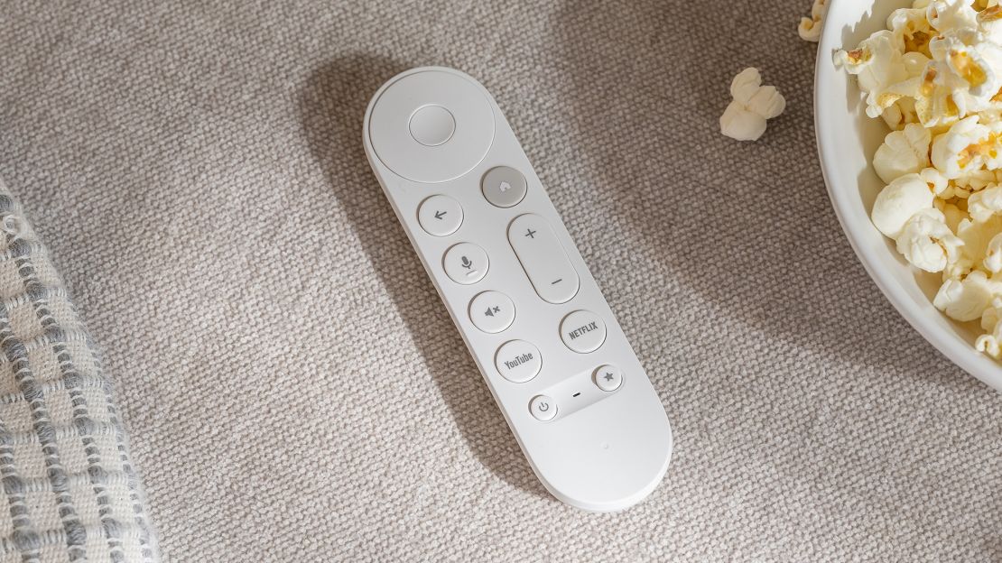 google tv streamer remote is next to popcorn