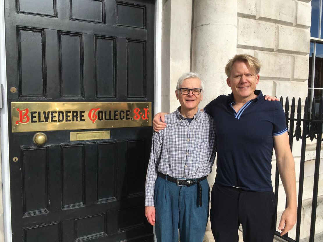 John Portmann with his partner Dan in front of Belvedere College, a Catholic school in Dublin where his biological grandfather James taught Latin and Greek.