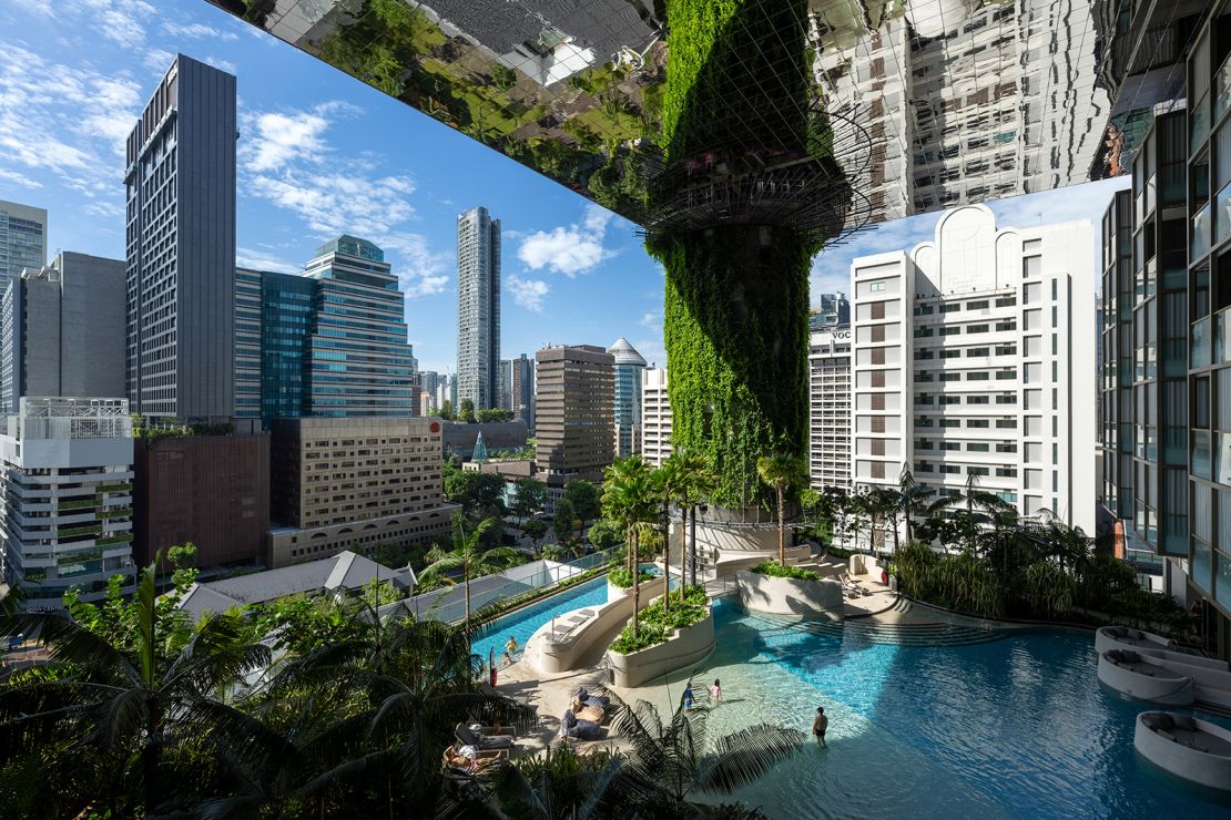 The lagoon-like swimming pool on the building's fifth-floor beach terrace.