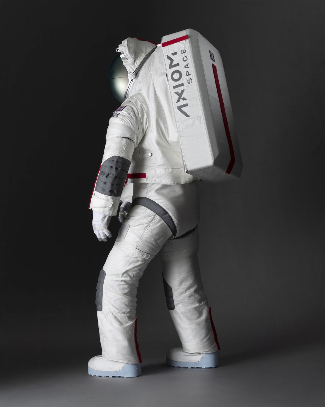 The spacesuit worn on the lunar surface is made from a white material that reflects heat and protects astronauts from extreme high temperatures and lunar dust.