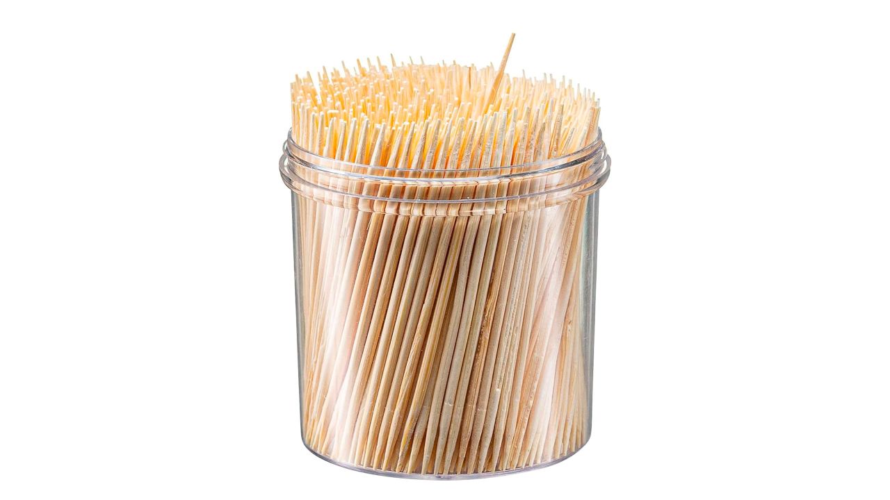 Plastic container full of toothpicks 