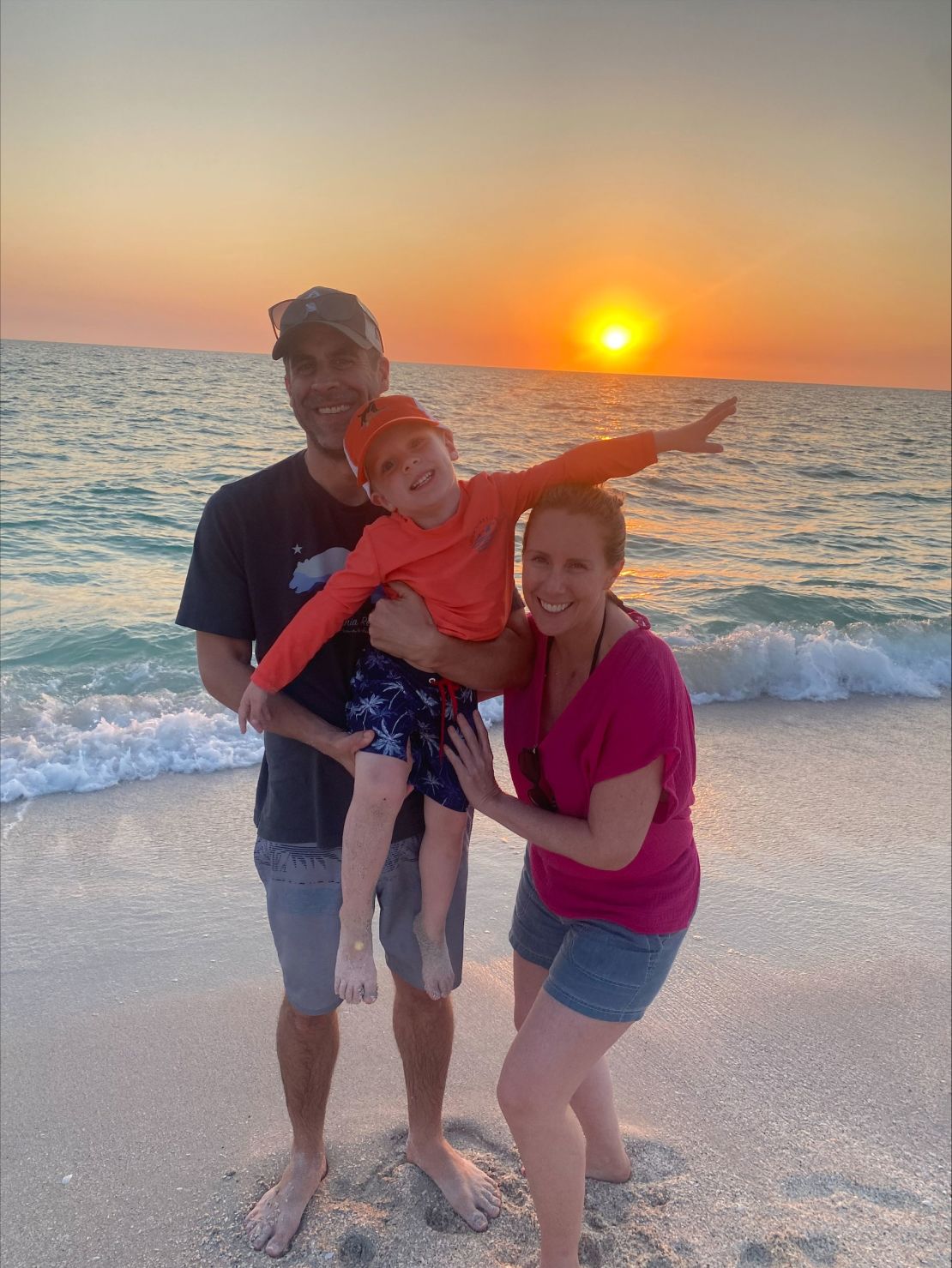 Jessica Schneider with her husband and son in Florida at six weeks pregnant.