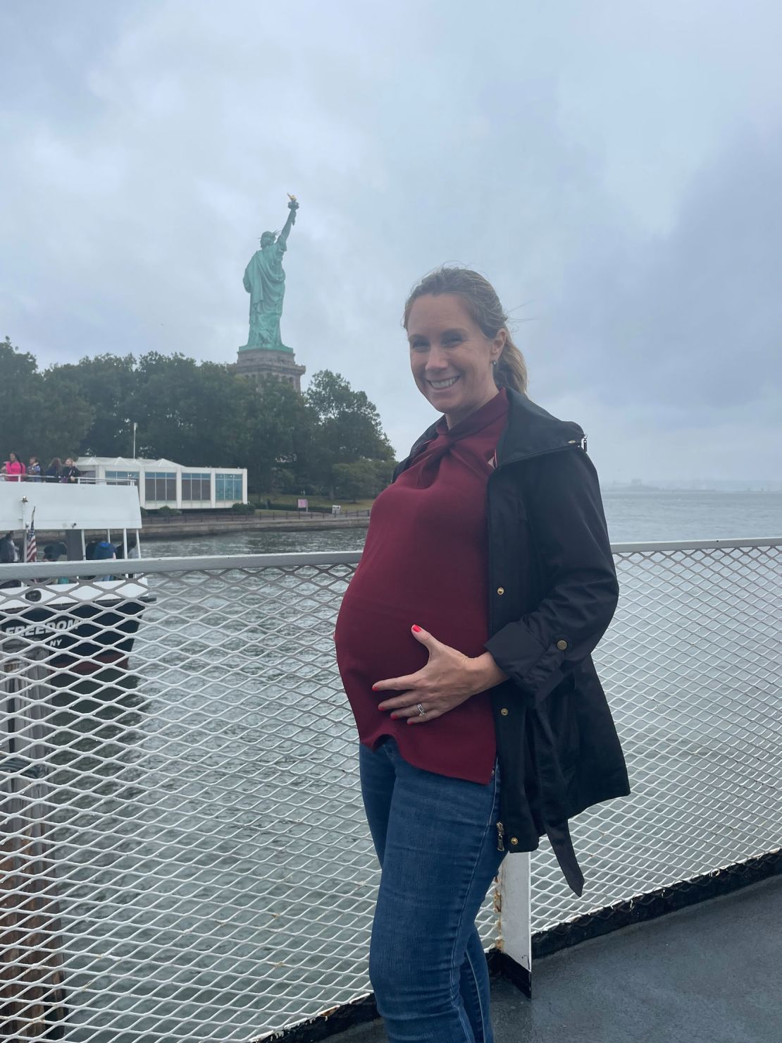 Jessica Schneider in front of the Statue of Liberty on a babymoon to New York last month.