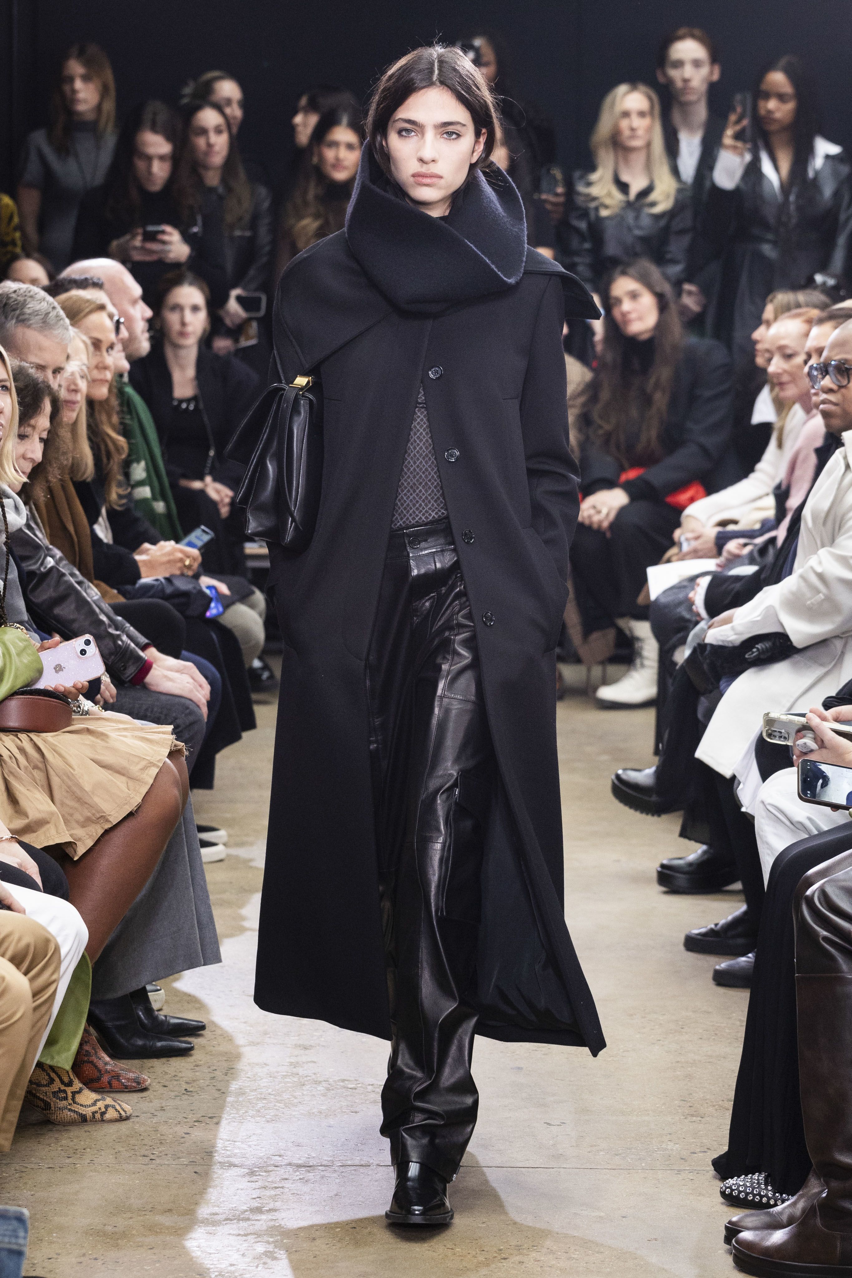 Highlights included tall cowl neck collars, asymmetrical cuts, knit capes and long apron dresses.