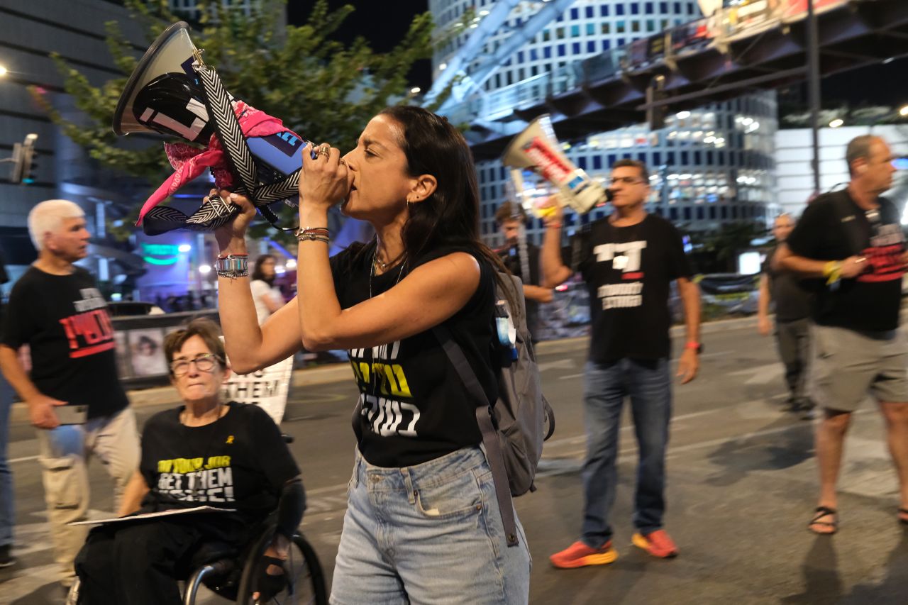 Demonstrators block a major thoroughfare in Tel Aviv on October 19, to protest against the government and demand a ceasefire deal.