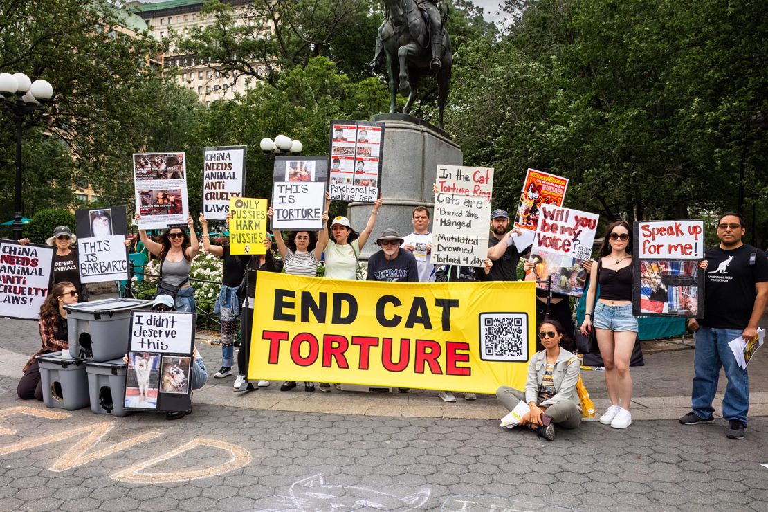 Activists hold placards during a demonstration in New York on May 18, 2025.