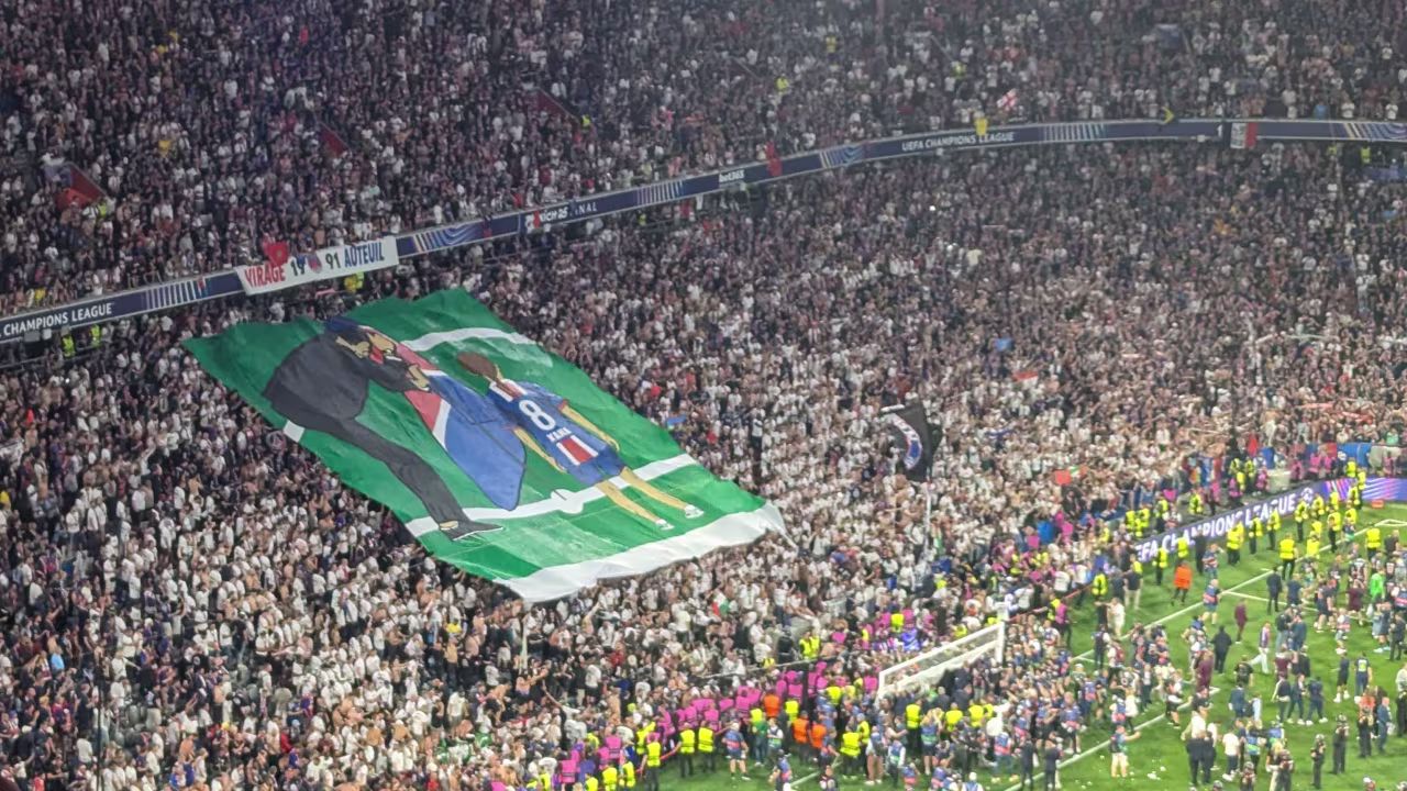 A banner depicts PSG manager Luis Enrique and his late daughter Xana after the match.