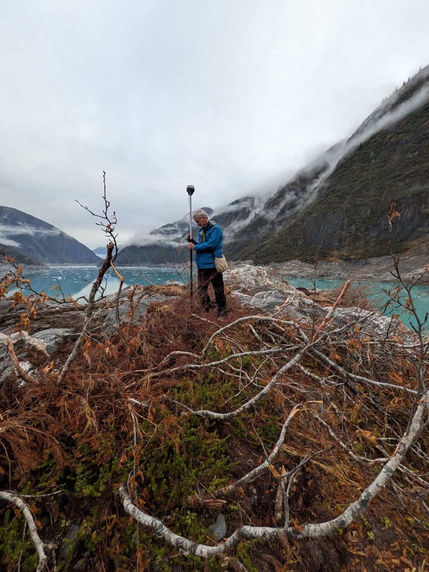 Journalist Paul Salopek observes damage from the Tracy Arm tsunami on a recent field research visit to the area in October.