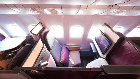 A photo of an individual Qatar Airways Qsuite business class seat