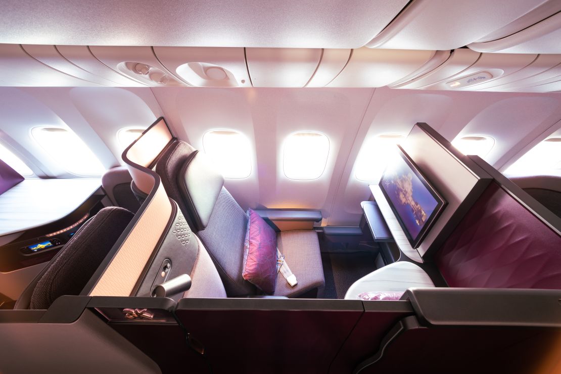 A photo of an individual Qatar Airways Qsuite business class seat