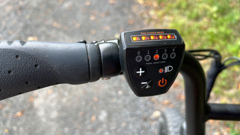 A RadRunner 2's handlebar-mounted control pod, showing it's five-segment LED power level indicator and controls.