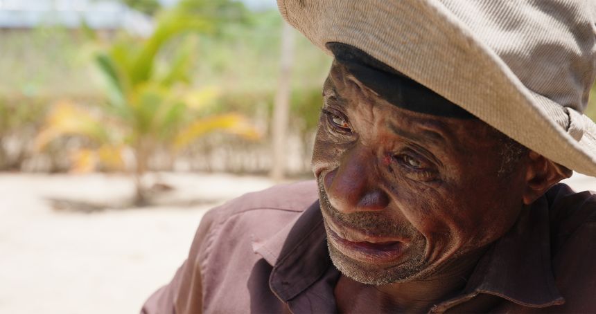 Rafael Ndinengo weeps as he re-enacts the beheading of his brother in law, Albano Nkwemba, 50, a security guard in Mocimboa da Praia. Nkwemba was killed in front of his family by ISIS, who appeared to know the homes they wanted to target in his community.