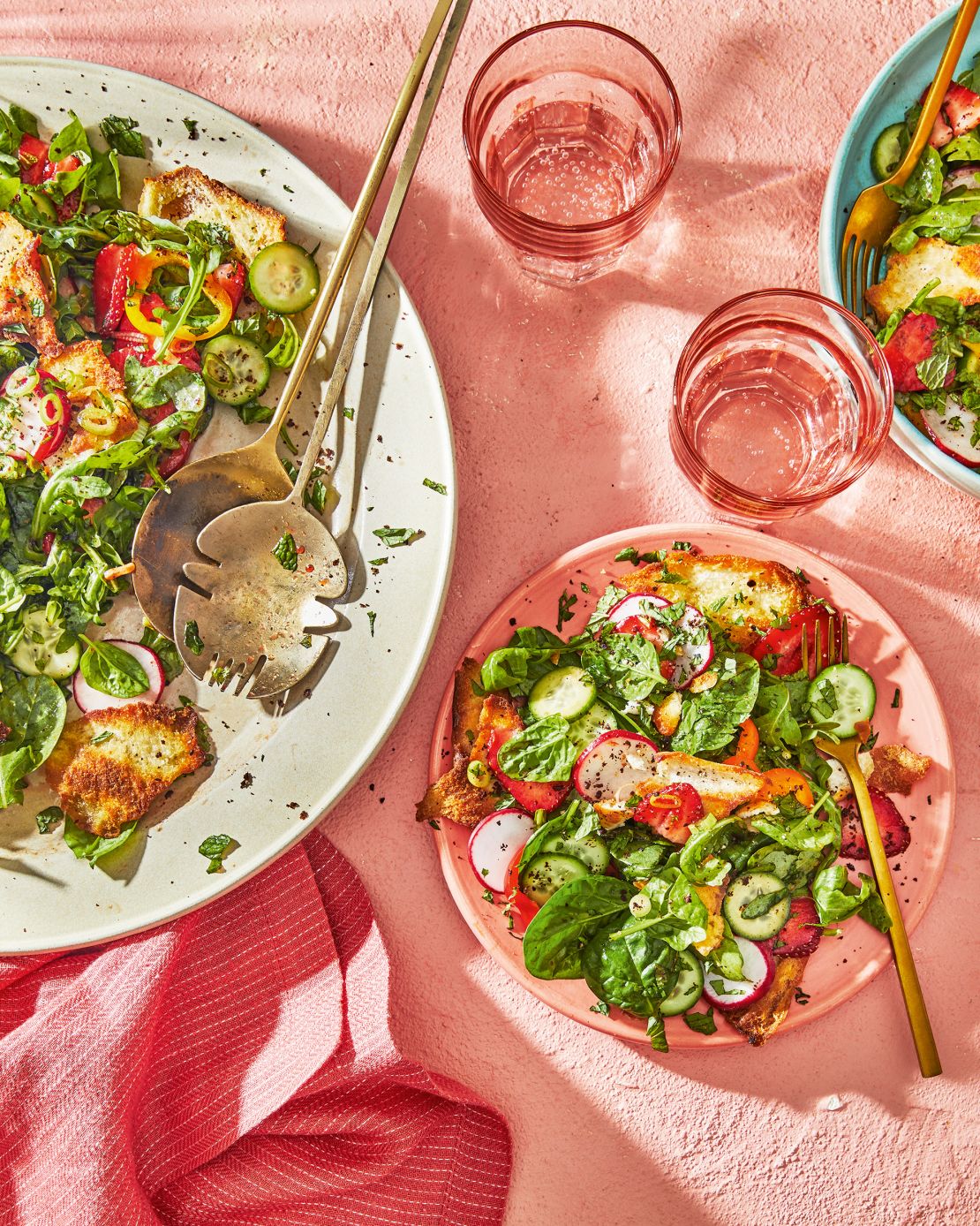 Strawberry, Arugula, and Spinach Fattoush is Karadsheh's spin on a classic Levantine salad that has a subtly sweet pomegranate molasses dressing and crisp pita chips seasoned with sumac, a tangy spice.