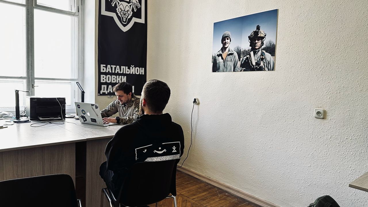 A potential new recruit is being interviewed at the Da Vinci Wolves Battalion’s recruitment office in Kyiv in May 2024.