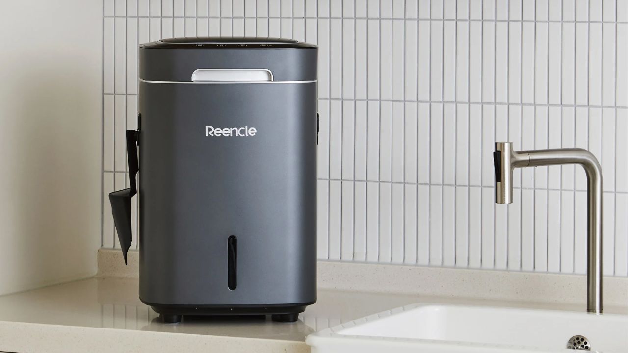Black Reencle prime composter device in white kitchen