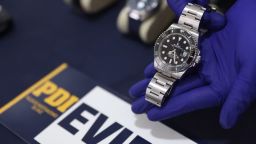 Chilean investigative police display a watch that was stolen from actor Keanu Reeves and seized in an operation in Santiago, at a conference in December 2024.