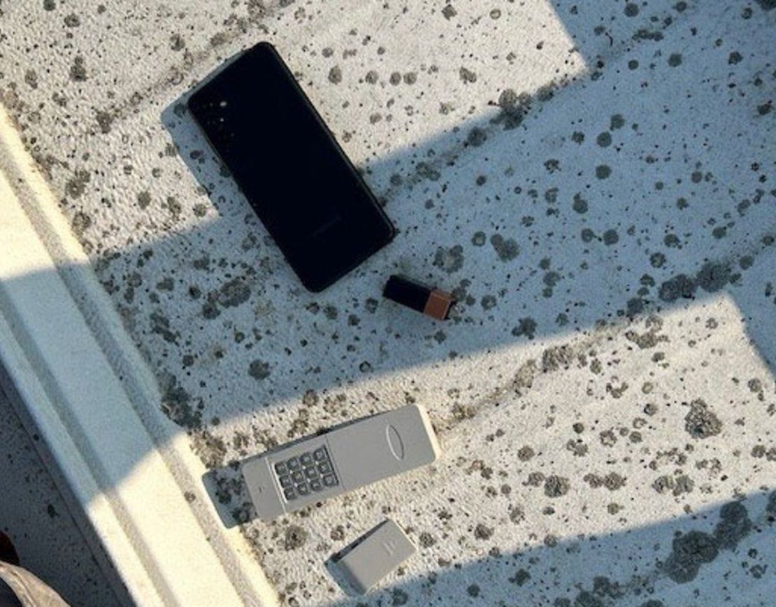 A phone and other device was found on the roof of the building where the shooter was.