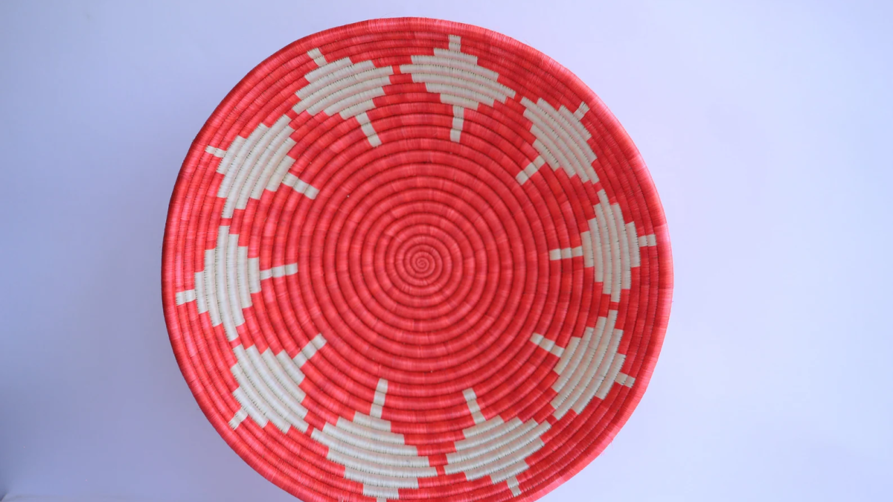 A red and grey patterned African basket.