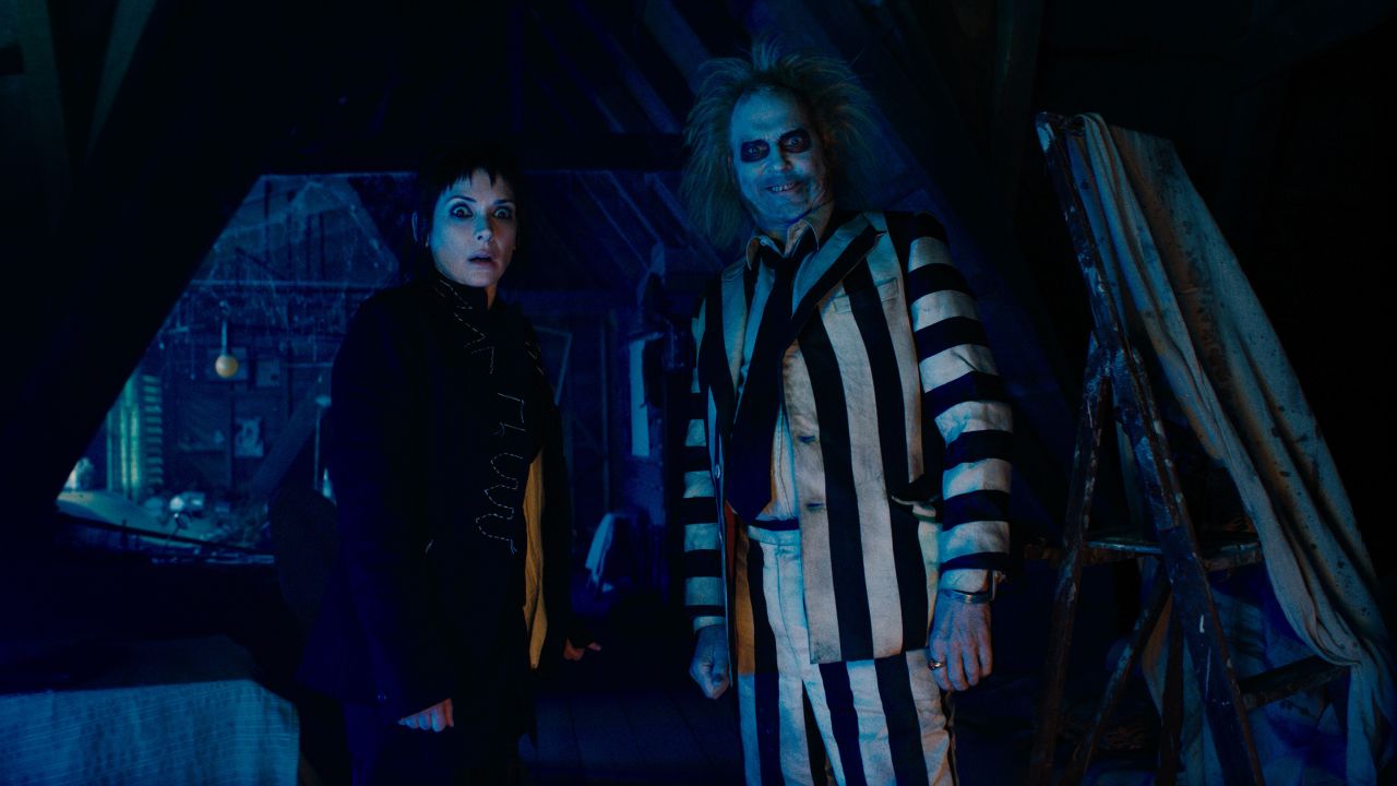 (L-r) WINONA RYDER as Lydia and MICHAEL KEATON as Beetlejuice in Warner Bros. Pictures’ comedy, “BEETLEJUICE BEETLEJUICE,” a Warner Bros. Pictures release.