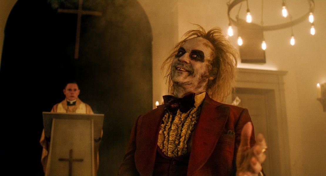 Beetlejuice's renowned burgundy wedding tux makes an appearance in the film's remake.