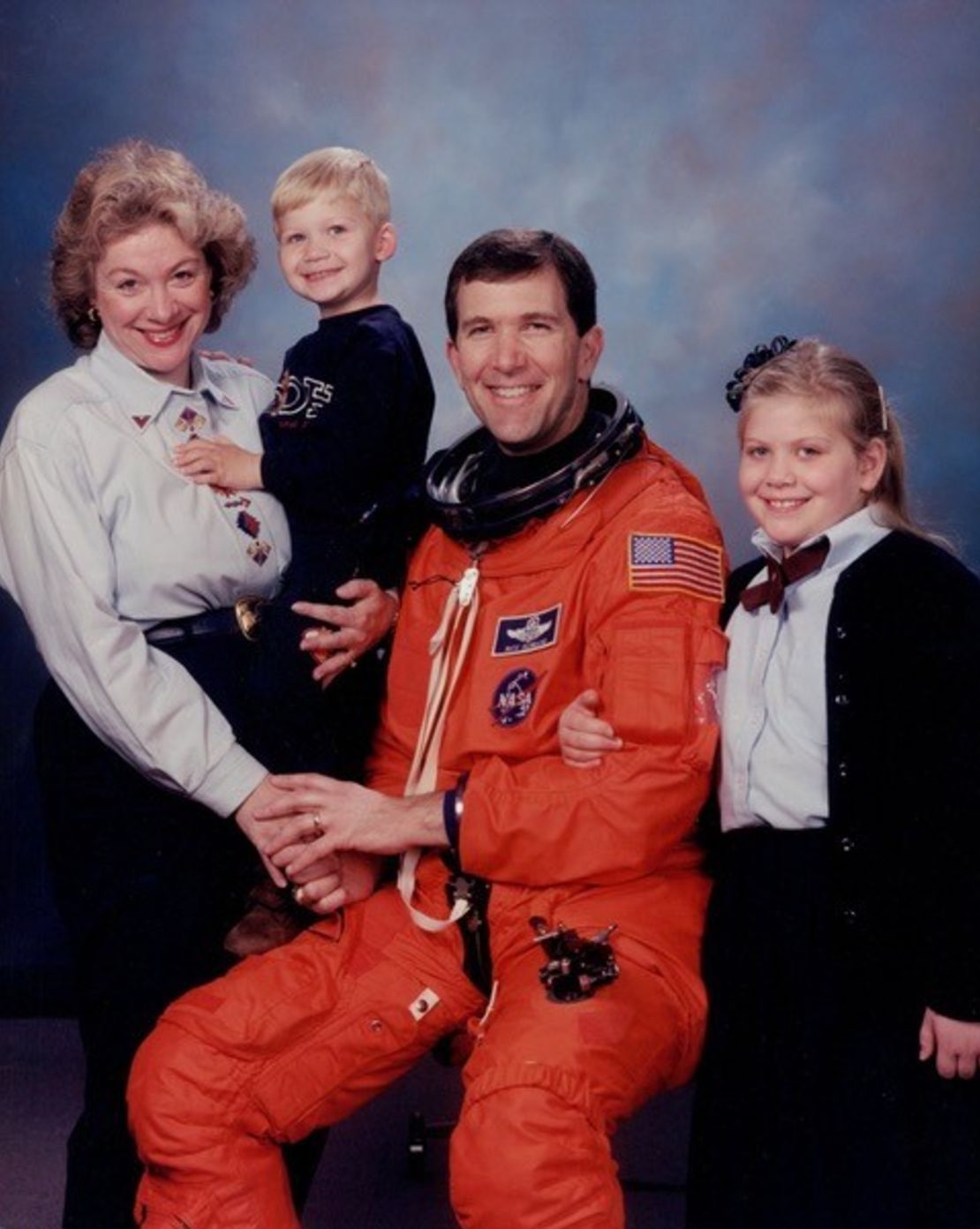 Evelyn Husband and her spouse, NASA astronaut Rick Husband, are seen with their children, Matthew and Laura.