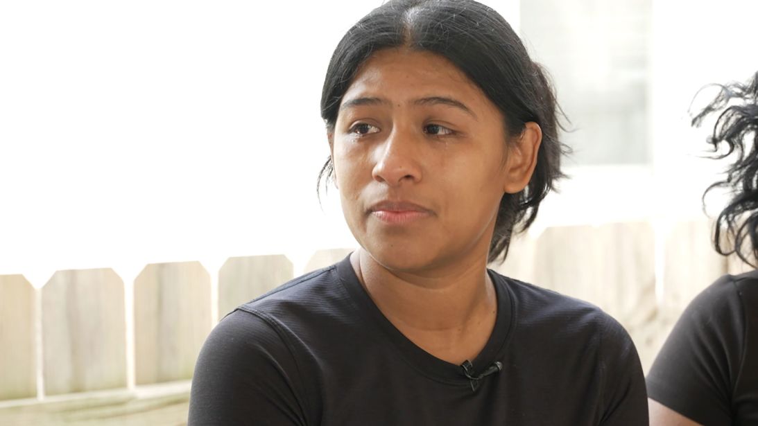 Rina Salado cries while talking about her mother, who was detained in an ICE raid in Omaha.