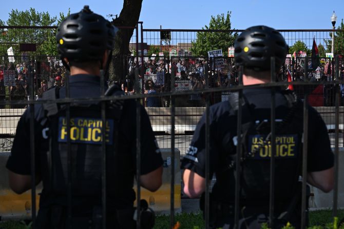 Protesters gather outside the United Center on Monday. <a href=