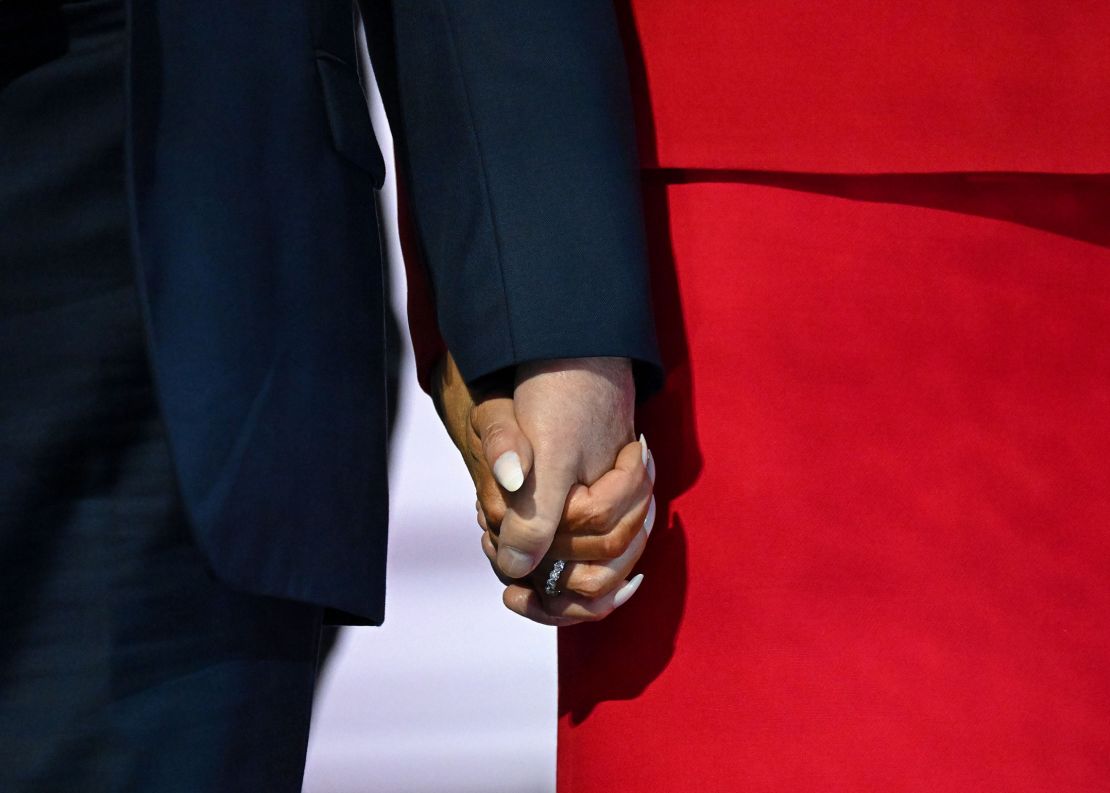 Trump holds hands with his wife after his speech in Milwaukee on the last day of the Republican National Convention.