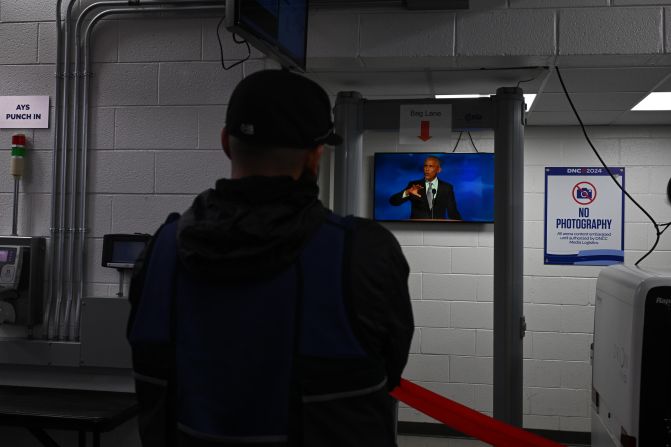 Obama's speech is shown on a TV screen inside the United Center on Tuesday.