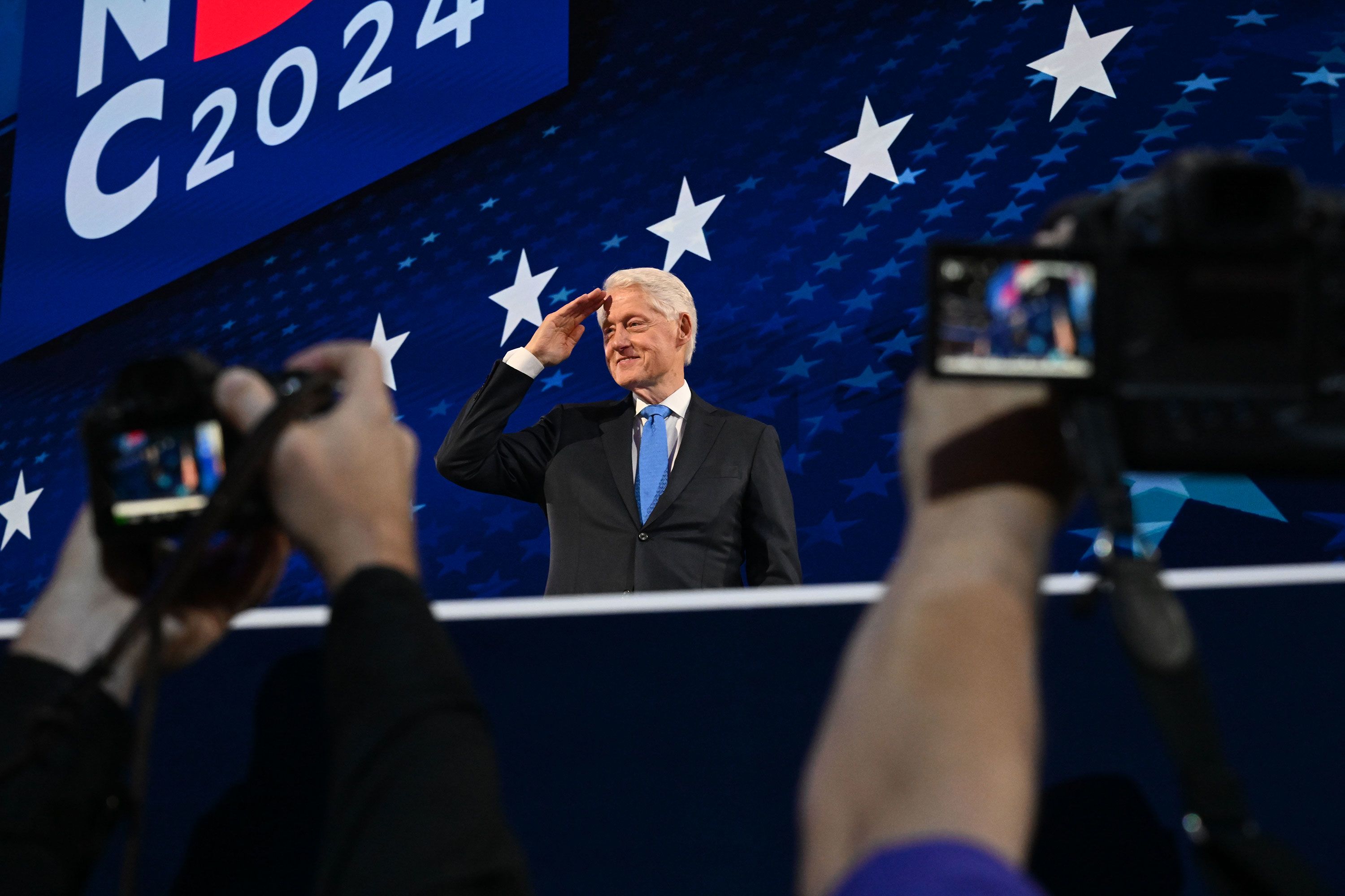Clinton salutes after speaking at the Democratic National Convention in Chicago in 2024.