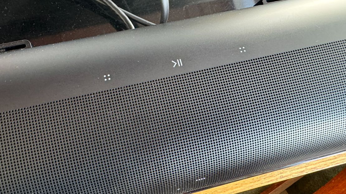 A close-up of the Sonos Arc’s volume and play/pause touch controls.