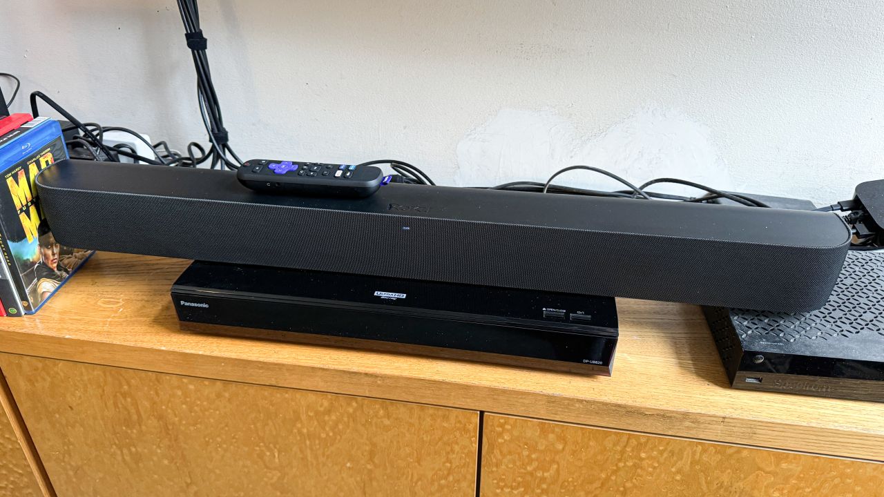 The Roku Streambar Pro sits on a 4K Blu-ray player, and doesn’t dangle too much off the sides.