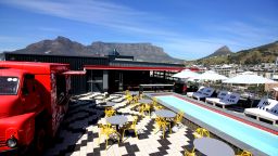 In addition to community projects, Mpahlwa's team also designs commercial properties, including the Radisson Red hotel in Cape Town. Pictured: the view from the rooftop pool at the hotel, with Table Mountain in the background.