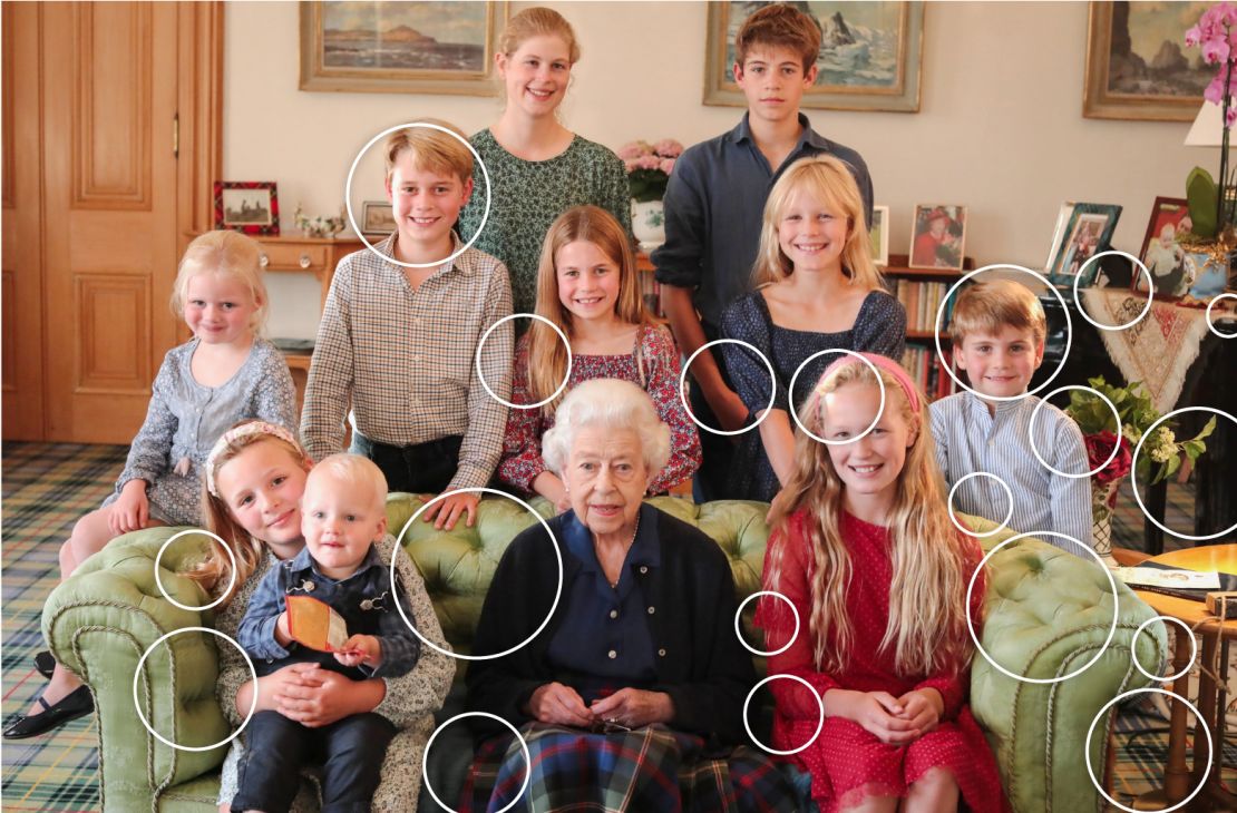 The photo, showing the Queen and 10 of her young relatives, was published last year. CNN has circled areas showing visible digital inconsistencies.