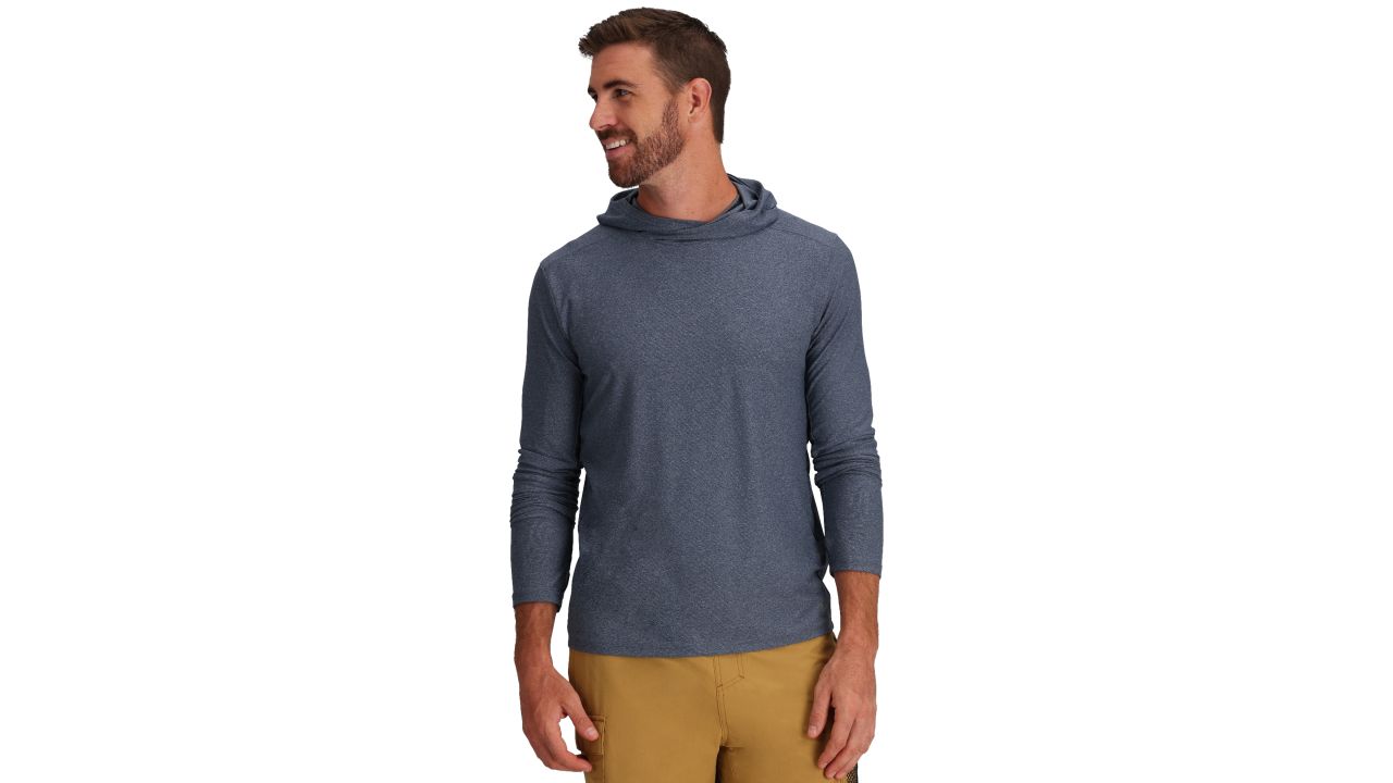 Man wearing royal robbins amp lite hoodie in navy color