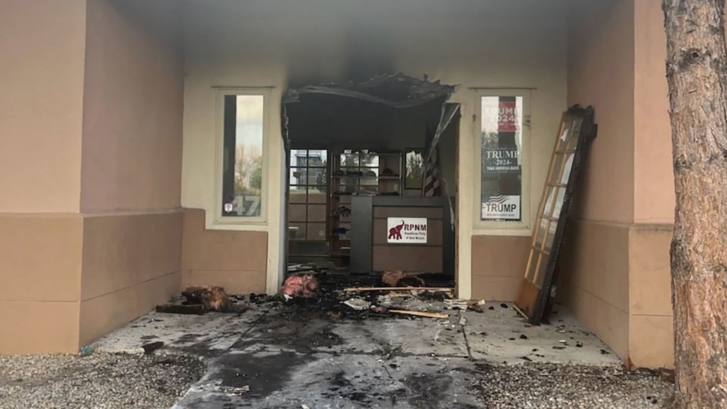 This photo provided by the Republican Party of New Mexico shows damage to the entry of the group's headquarters in Albuquerque on Sunday, March 30, 2025.