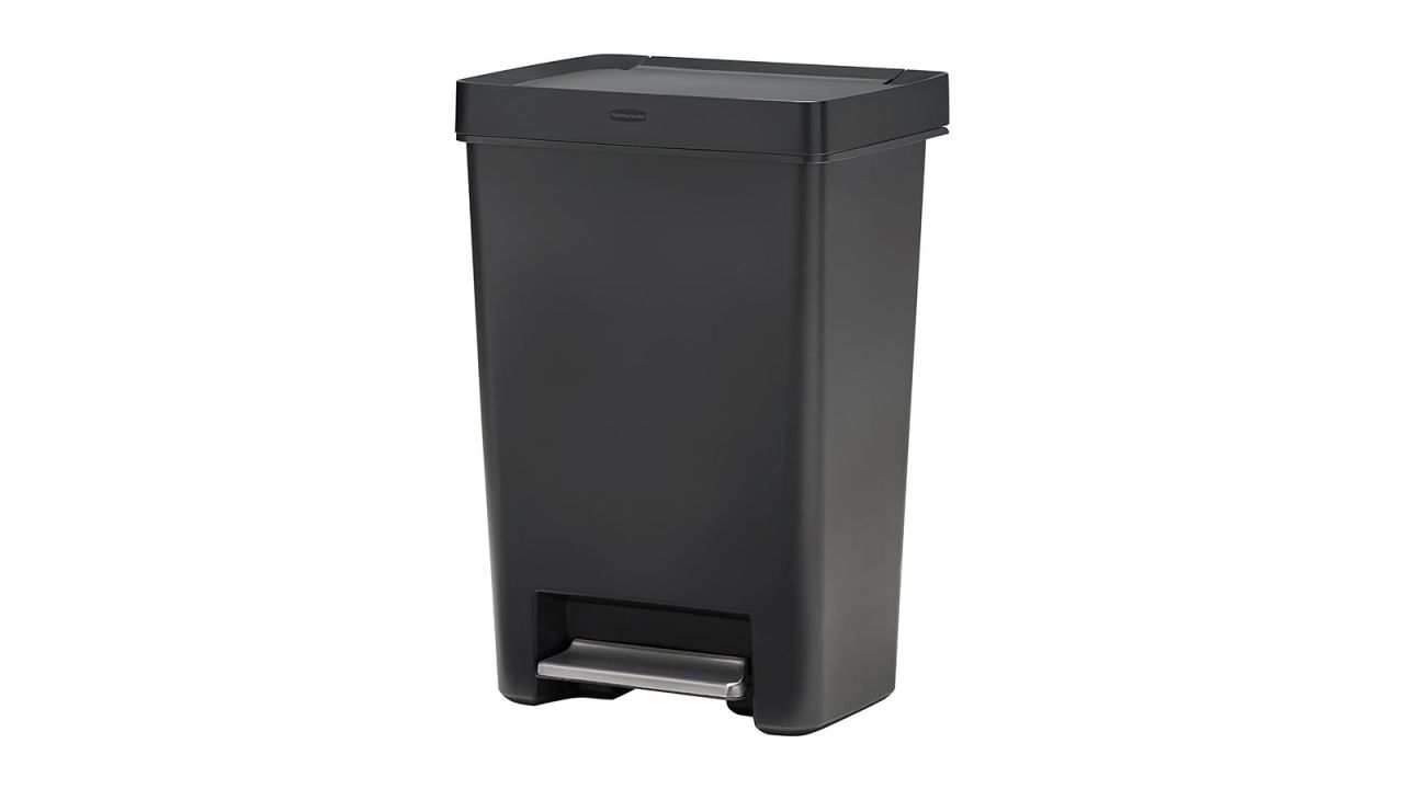 A plastic black trash can on a white background.