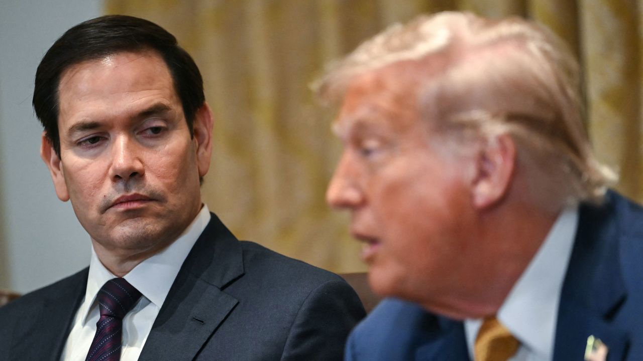 (L/R) US Secretary of State Marco Rubio looks on as President Donald Trump speaks during a cabinet meeting in the Cabinet Room of the White House in Washington, DC, on July 8, 2025.