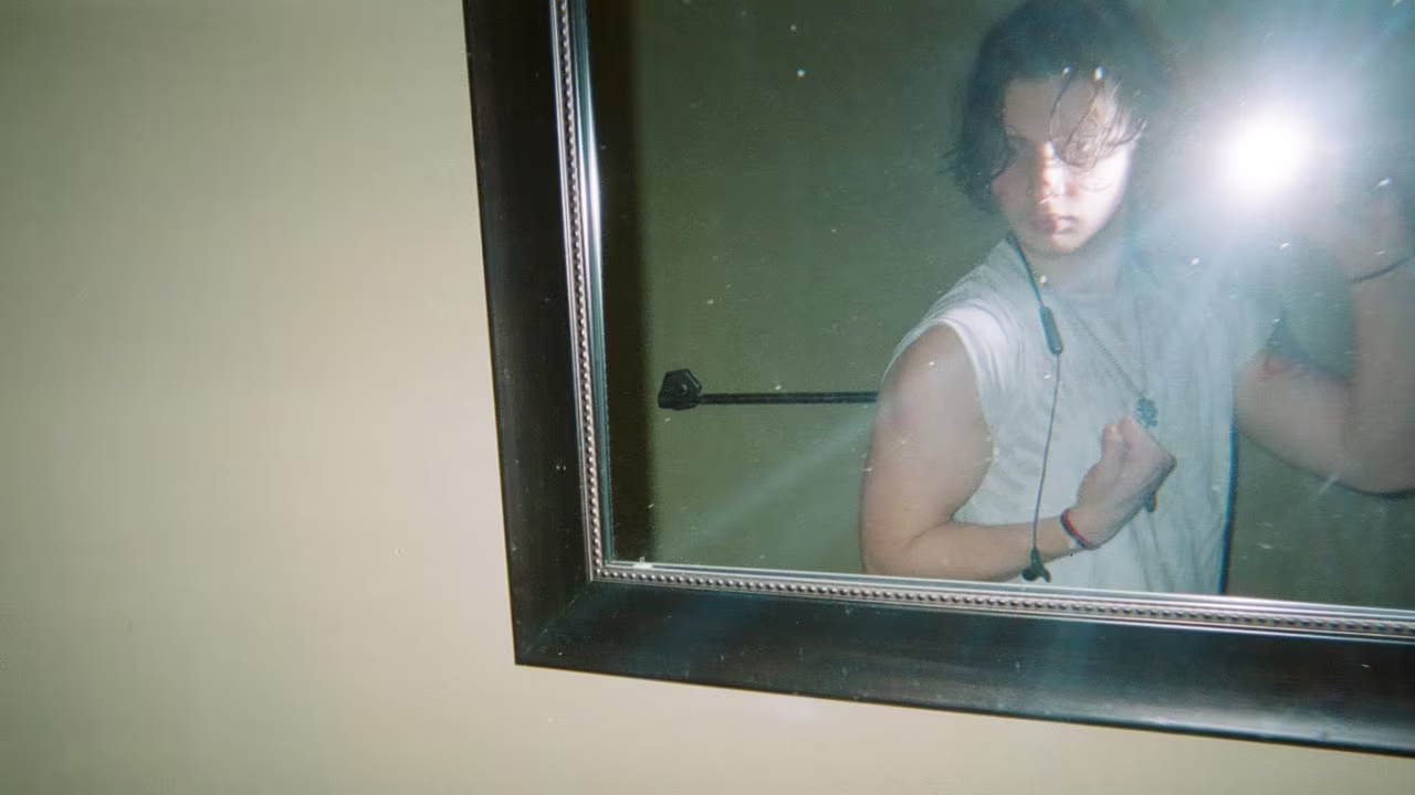 Ruby Stabreit flexes in a mirror. "I love my arms. I love them very much,” Stabreit said.