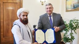 The new Afghan ambassador to Russia, Gul Hassan Hassan, hands his credentials to Russian Deputy Foreign Minister Andrey Rudenko.