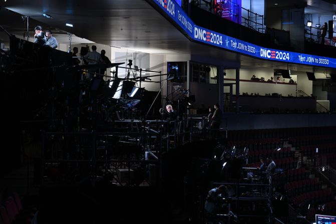 A television journalist works from his booth inside the United Center on Sunday.