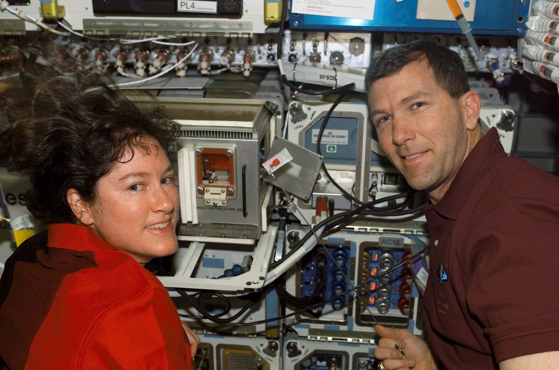 Mission Specialist Laurel B. Clark and Commander Rick D. Husband are seen near supportive equipment for experiments on the SPACEHAB Research Double Module aboard the space shuttle Columbia.