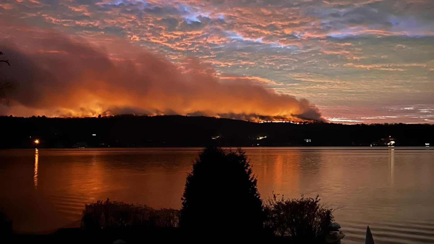 Plumes of smoke drift off from the Jennings Creek Wildfire along the New York-New Jersey border on Sunday.