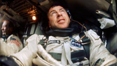 S66-63540 (12 Nov. 1966) --- Astronaut James A. Lovell is photographed inside his Gemini spacecraft during the Gemini-12 mission. Astronaut Edwin Aldrin is seen in the background and to the left. 